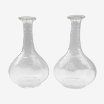 Pair of crystal decanters with cut collar and engraved body with R monograms
