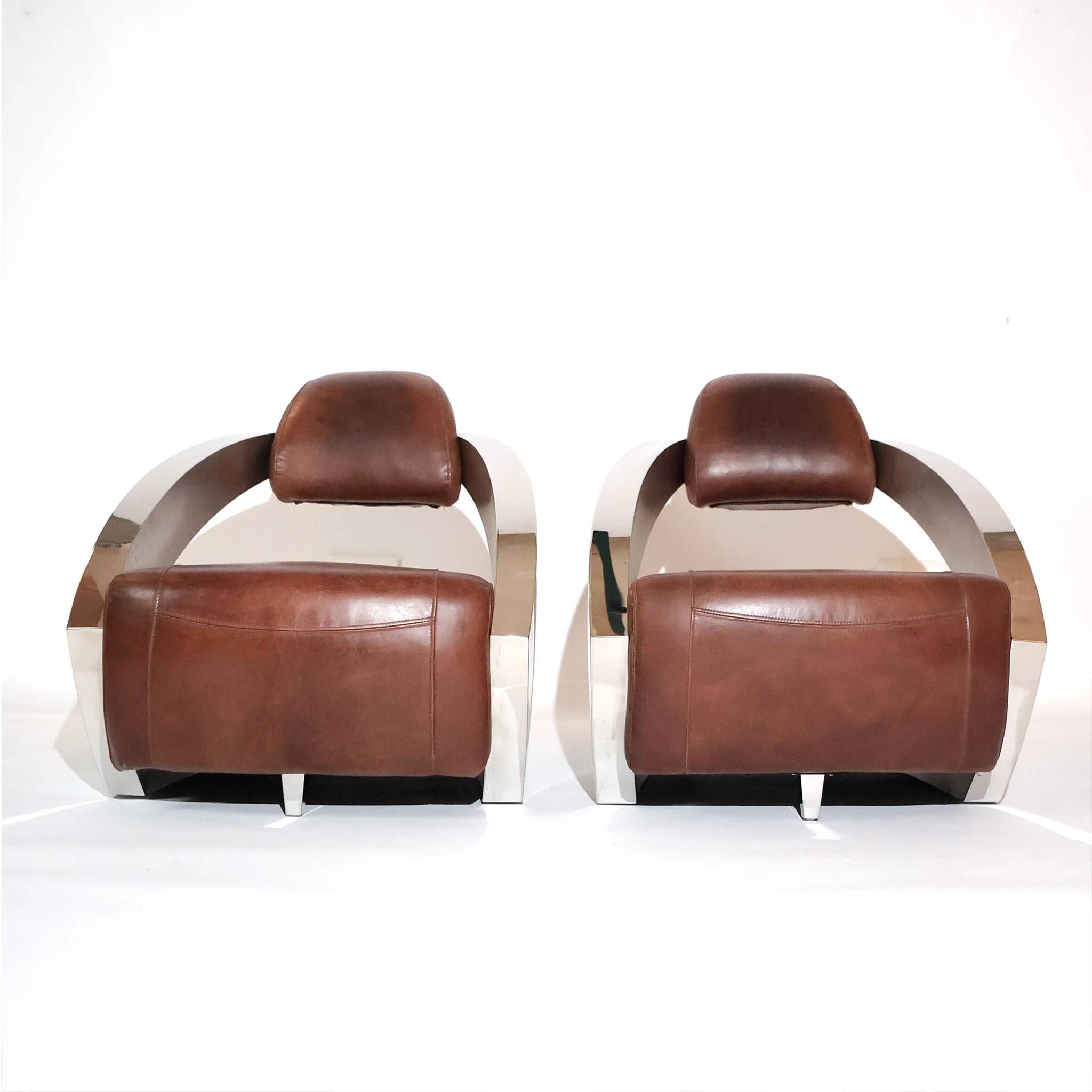Pair of vintage lounge chairs Demon/Aviator in cognac leather and polished steel, Art Deco style.