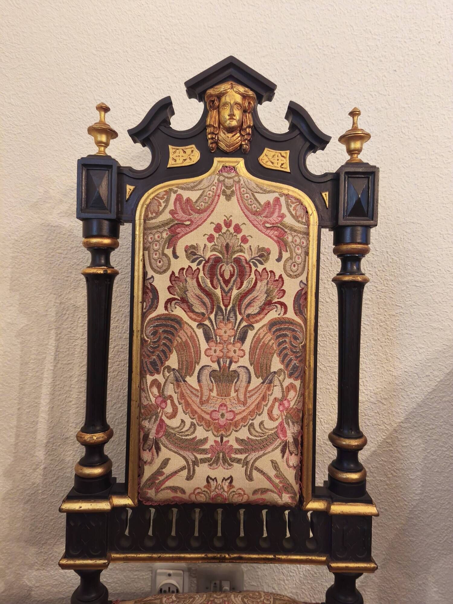 Historicist chair in ebonised and gilded wood