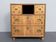 Antique campaign chest / ship’s chest, England, 1940s. Mahogany with a distinctive grain, brass inlays and hardware.