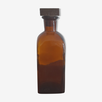 Amber liqueur bottle with wooden cap