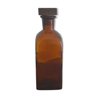 Amber liqueur bottle with wooden cap