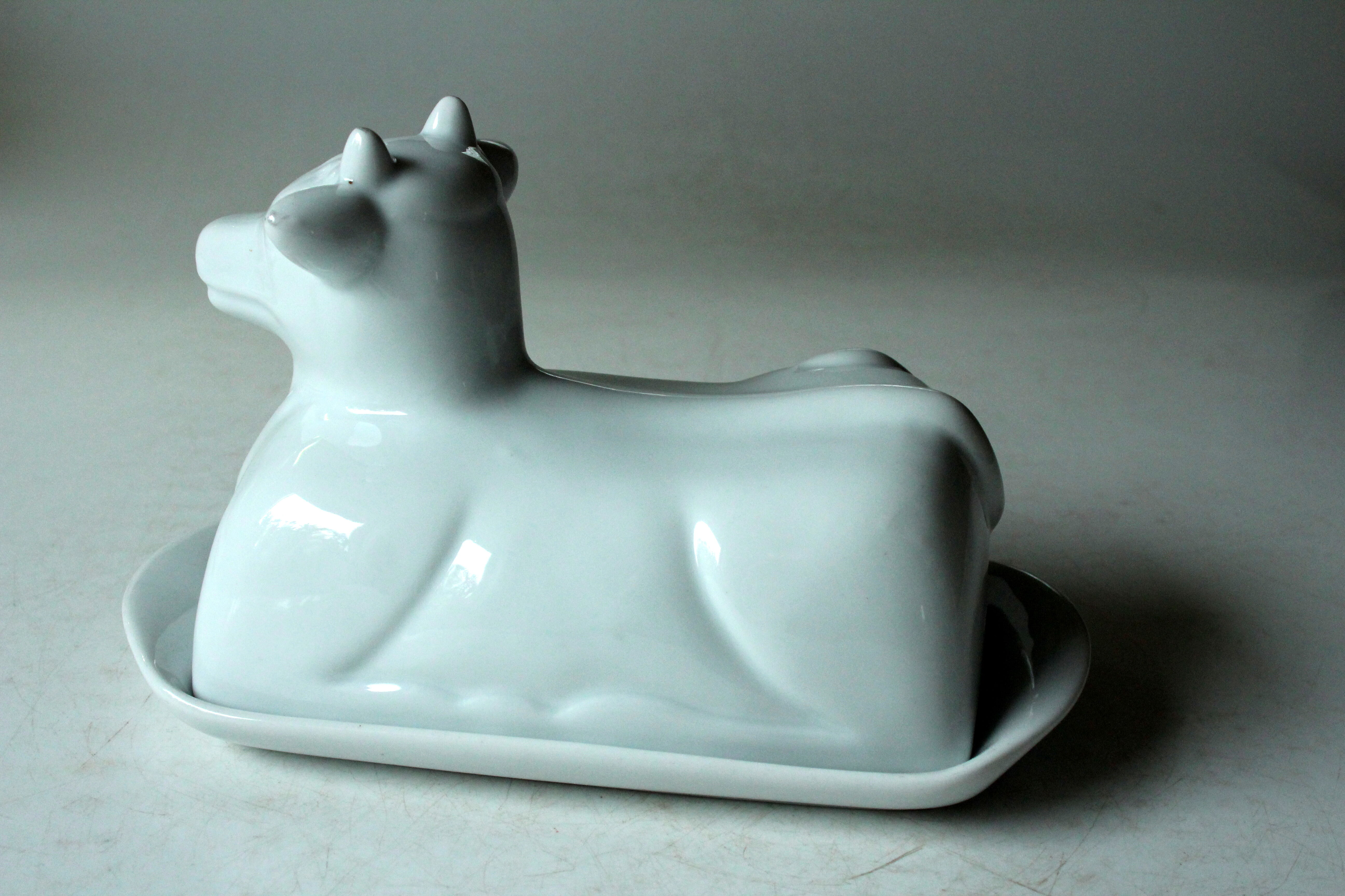 White ceramic butter dish in the shape of a cow, vintage