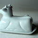 White ceramic butter dish in the shape of a cow, vintage