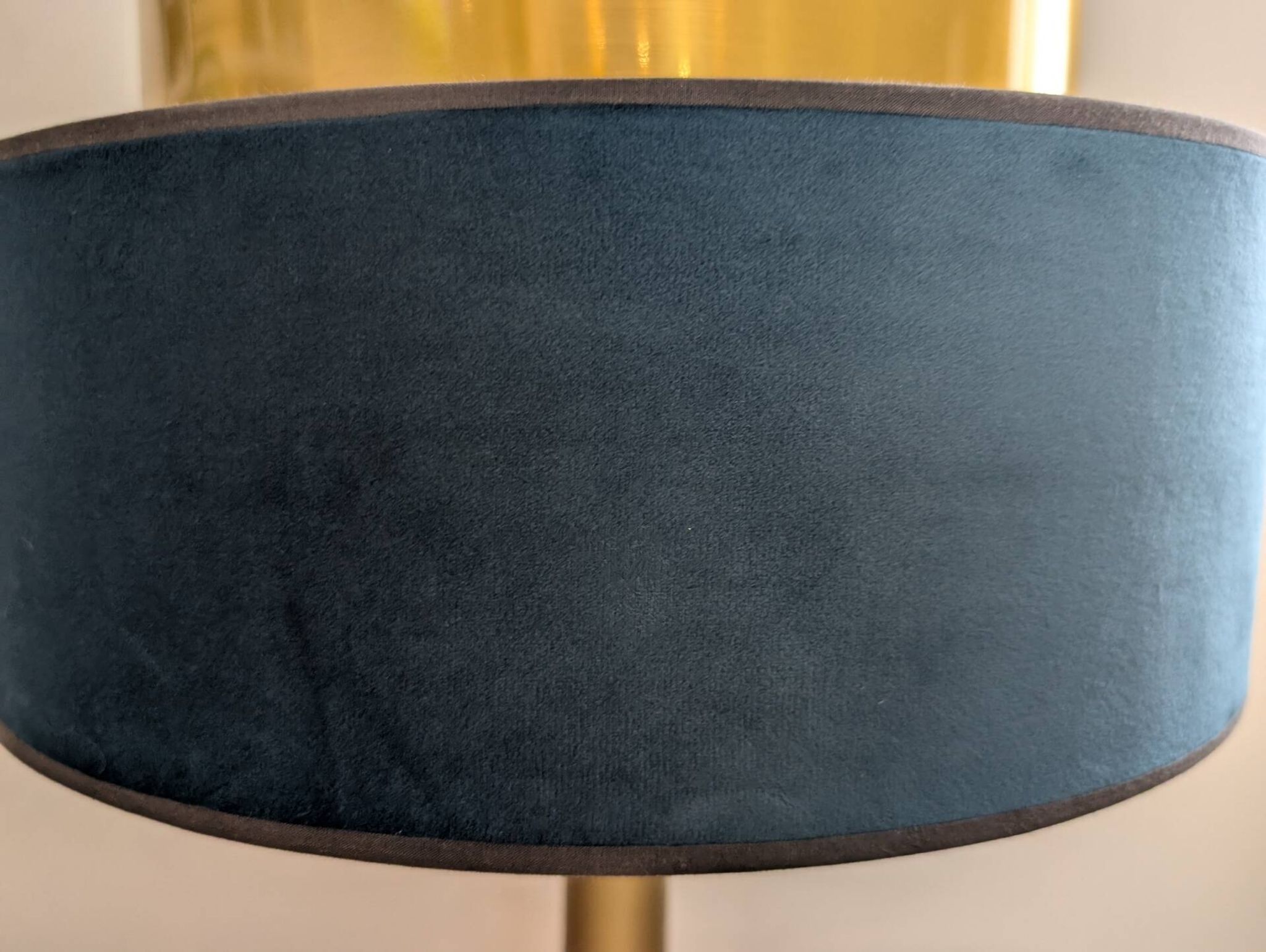 Brass lamp with asymmetrical velvet shade