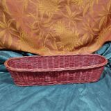 Old bread basket for baguette or red banneton in woven wicker