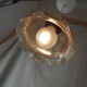 Suspension in a ribbed tulip shape, made of smoked glass.