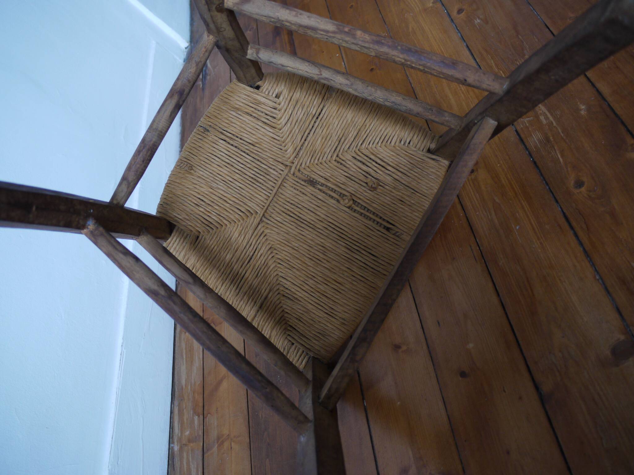 Wooden chair with straw seat