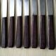 Set de 9 couteaux de table vintage inox et bakélite brune
