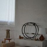 Decorative shelf unit, round metal frames with curved legs and glass shelves, 1960.