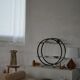 Decorative shelf unit, round metal frames with curved legs and glass shelves, 1960.