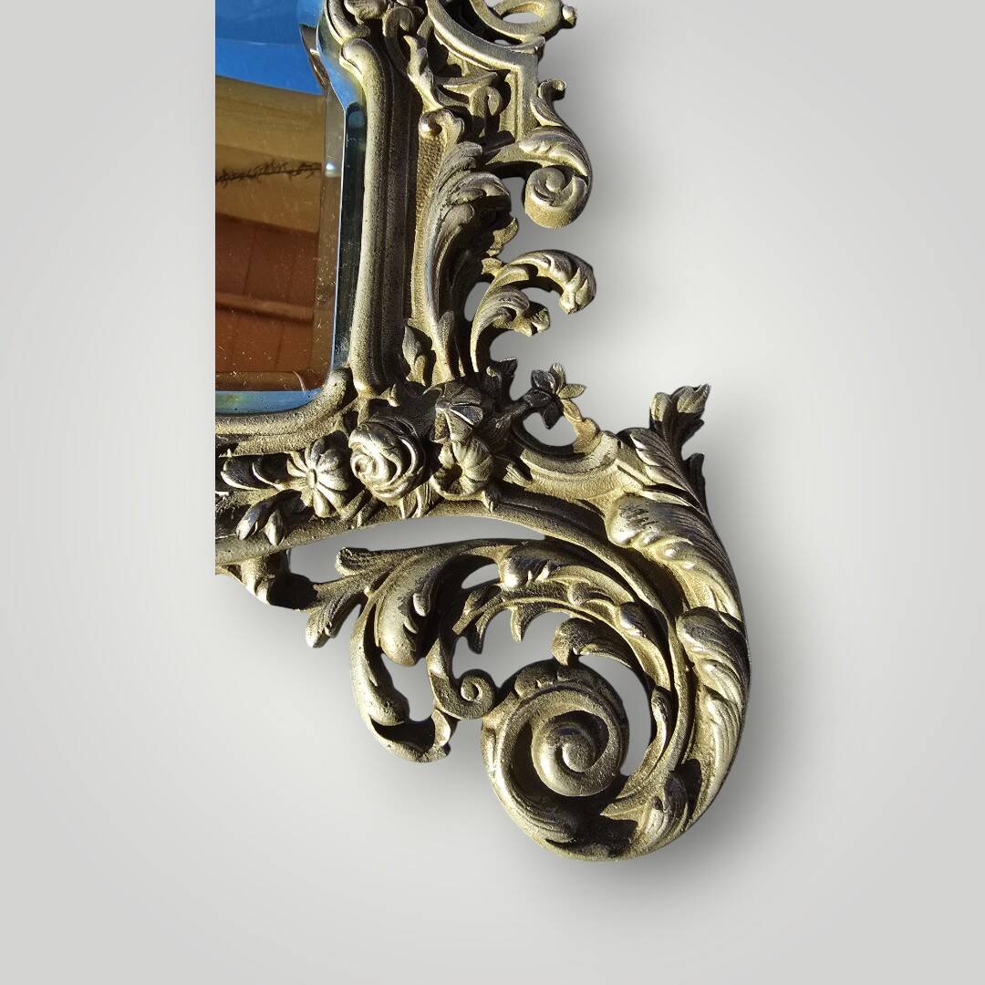 Gilded bronze wall mirror, beveled glass