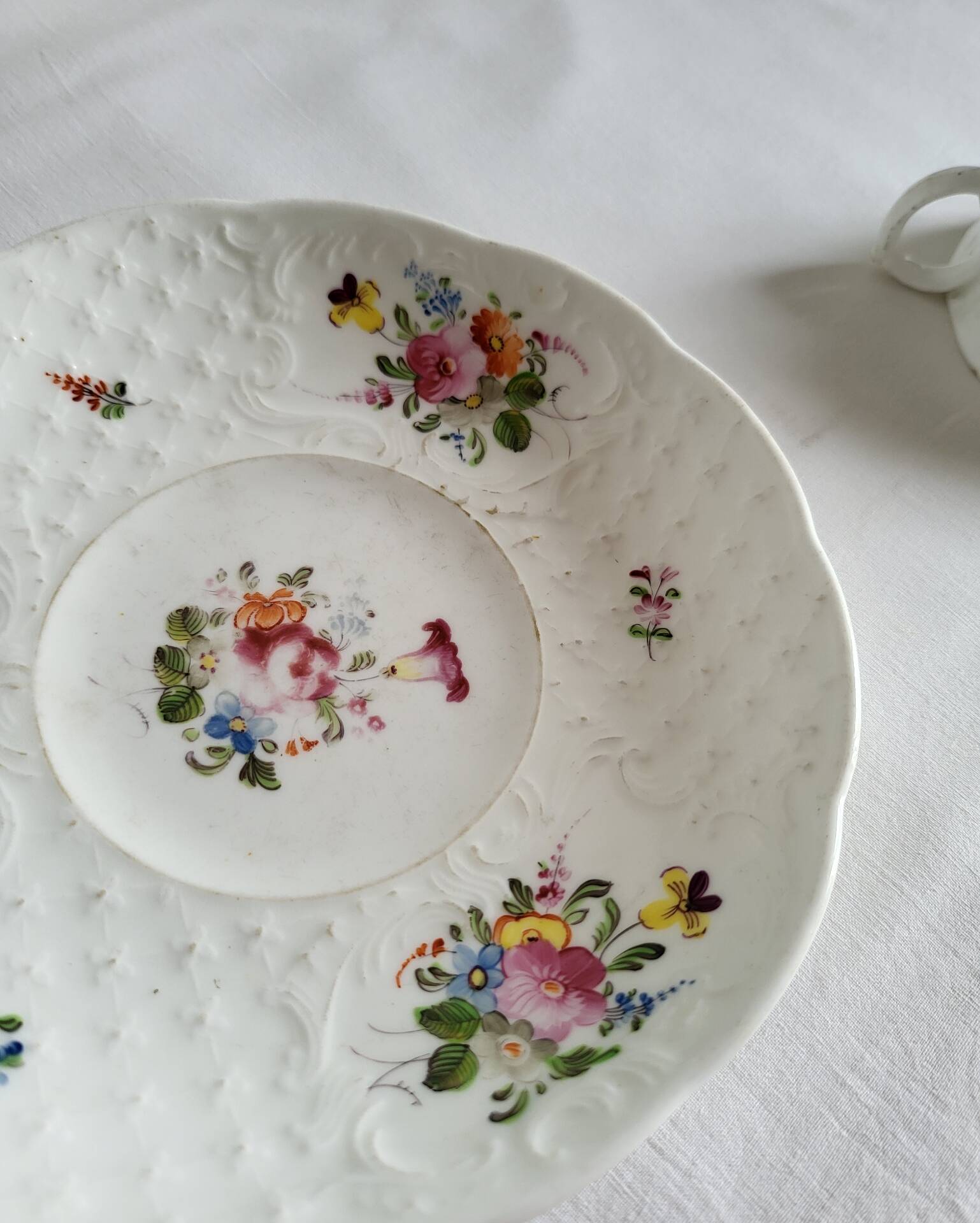 Antique Cup and Saucer in Porcelain with Hand-Painted Floral Decoration