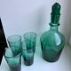 Set of a decanter and 4 design glasses in green glass 70s
