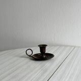 Small antique candle holder in patinated metal