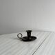 Small antique candle holder in patinated metal