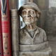 Book-clamps couple of realistic old men in plaster