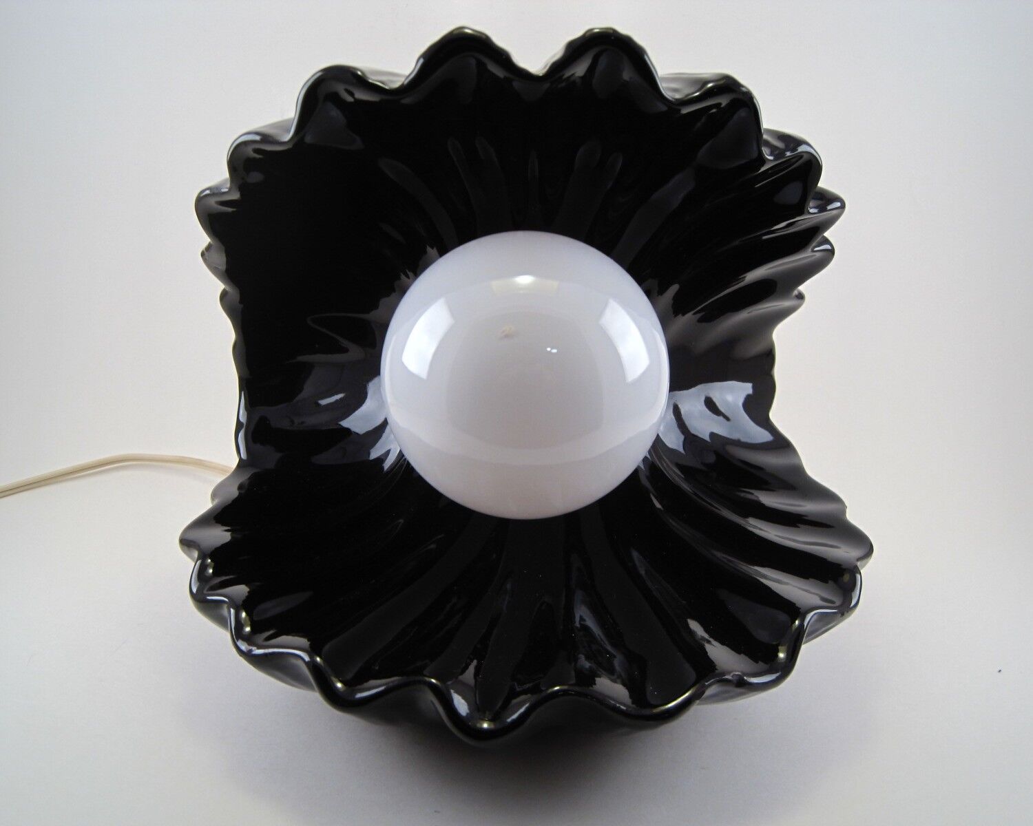 Vintage shell table lamp in black enamel ceramics design seventies 1970