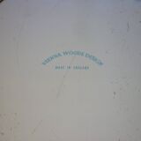 Blue cashmere round tray on white background.