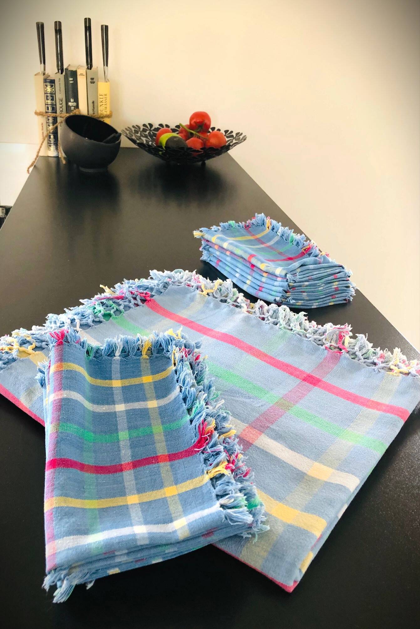 Vintage tablecloth & napkins, blue with multicoloured stripes.
