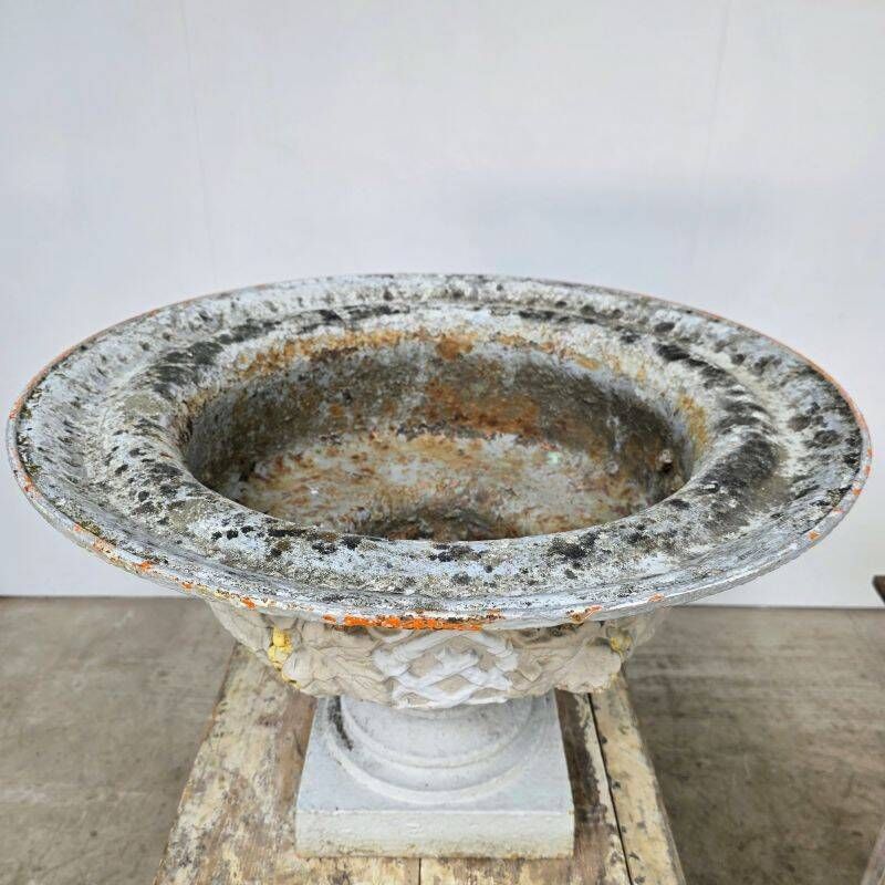 Large pair of 19th-century cast iron basins with vine decoration.
