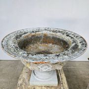 Large pair of 19th-century cast iron basins with vine decoration.