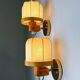 Pair of articulated "Cocoon" wall lights, resin and pine, Italy, 1970s