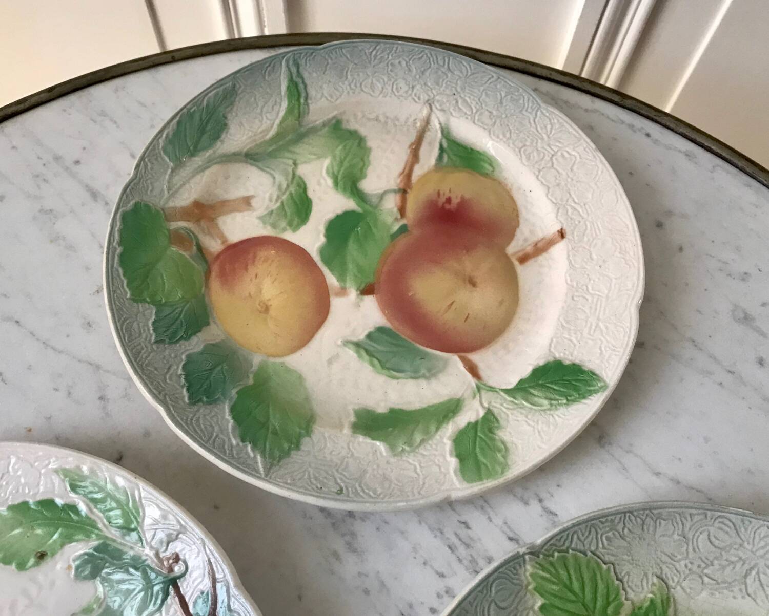 Trio of St Clement dessert plates in 19th century slip