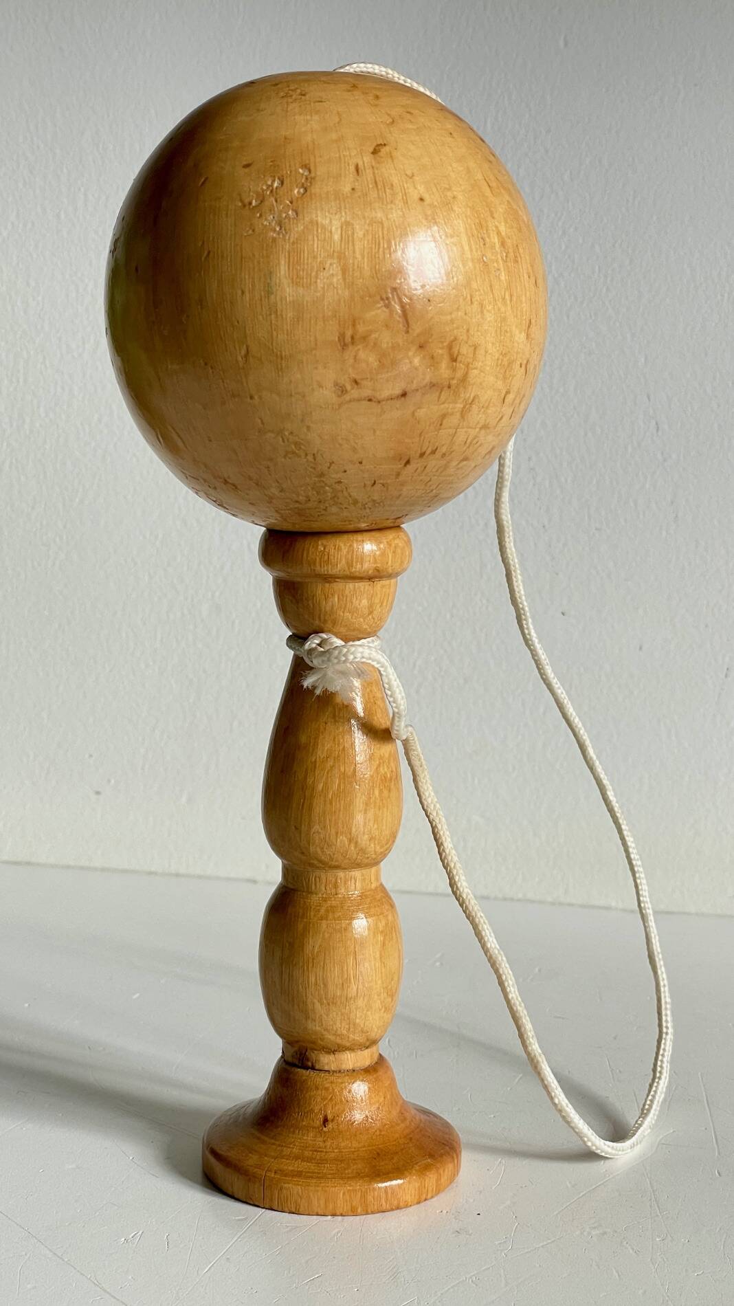 Vintage wooden cup-and-ball toy