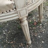 Antique armchair in Louis XVI style from the late 19th century.