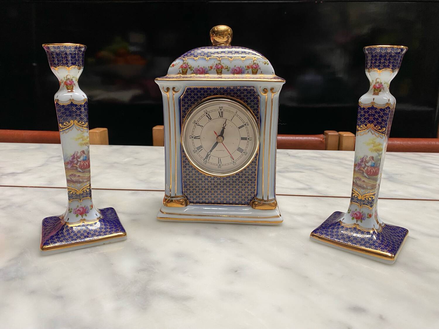 English porcelain clock and candle holders