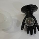 Paire d’appliques mains noires tenant un globe en opaline, années 70