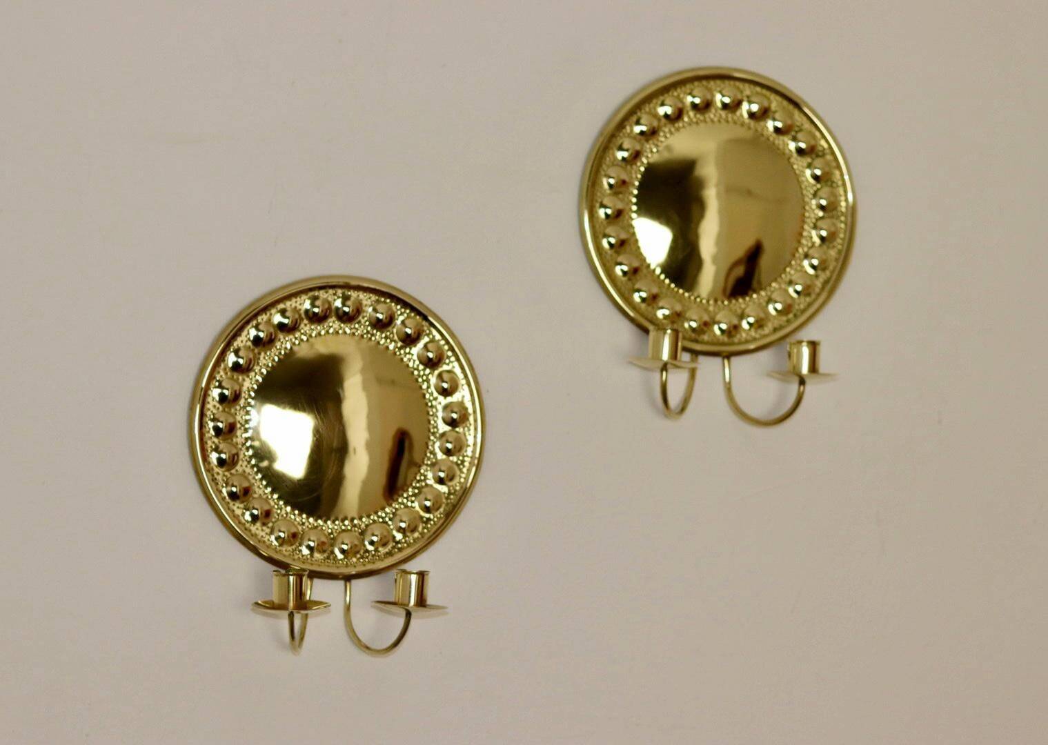 A pair of Swedish brass wall lights from the 1970s.