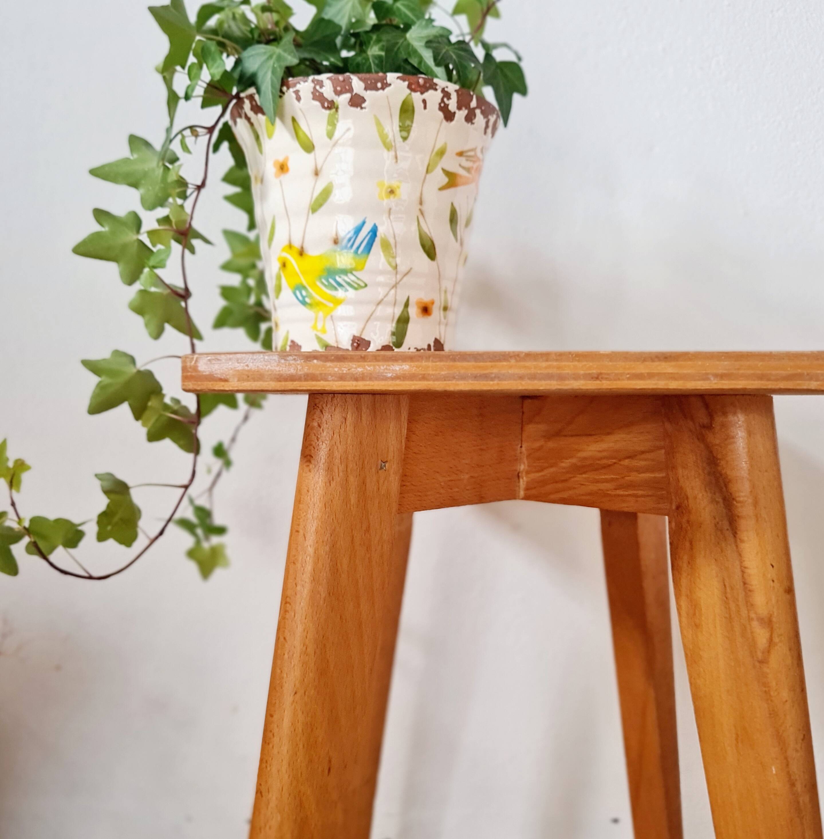 Wooden stool with tapered legs