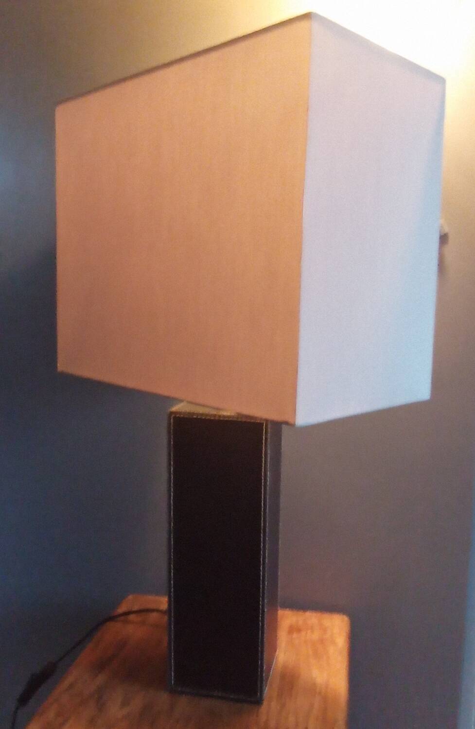 Tall cubic brown leather lamp, light gray fabric lampshade