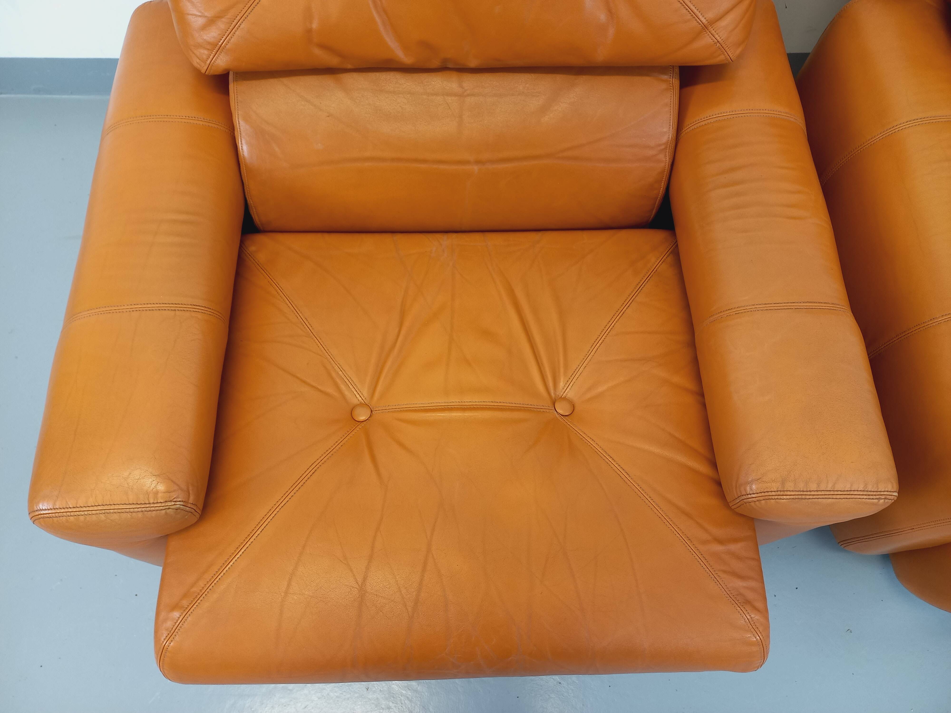 Pair of vintage leather lounge chairs from the 60s and 70s