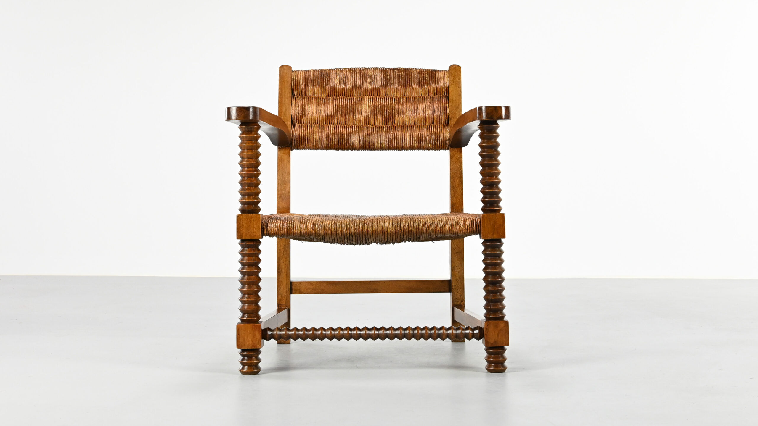 Pair of French armchairs with twisted legs in the style of Charles Dudouyt, France, 1940s.