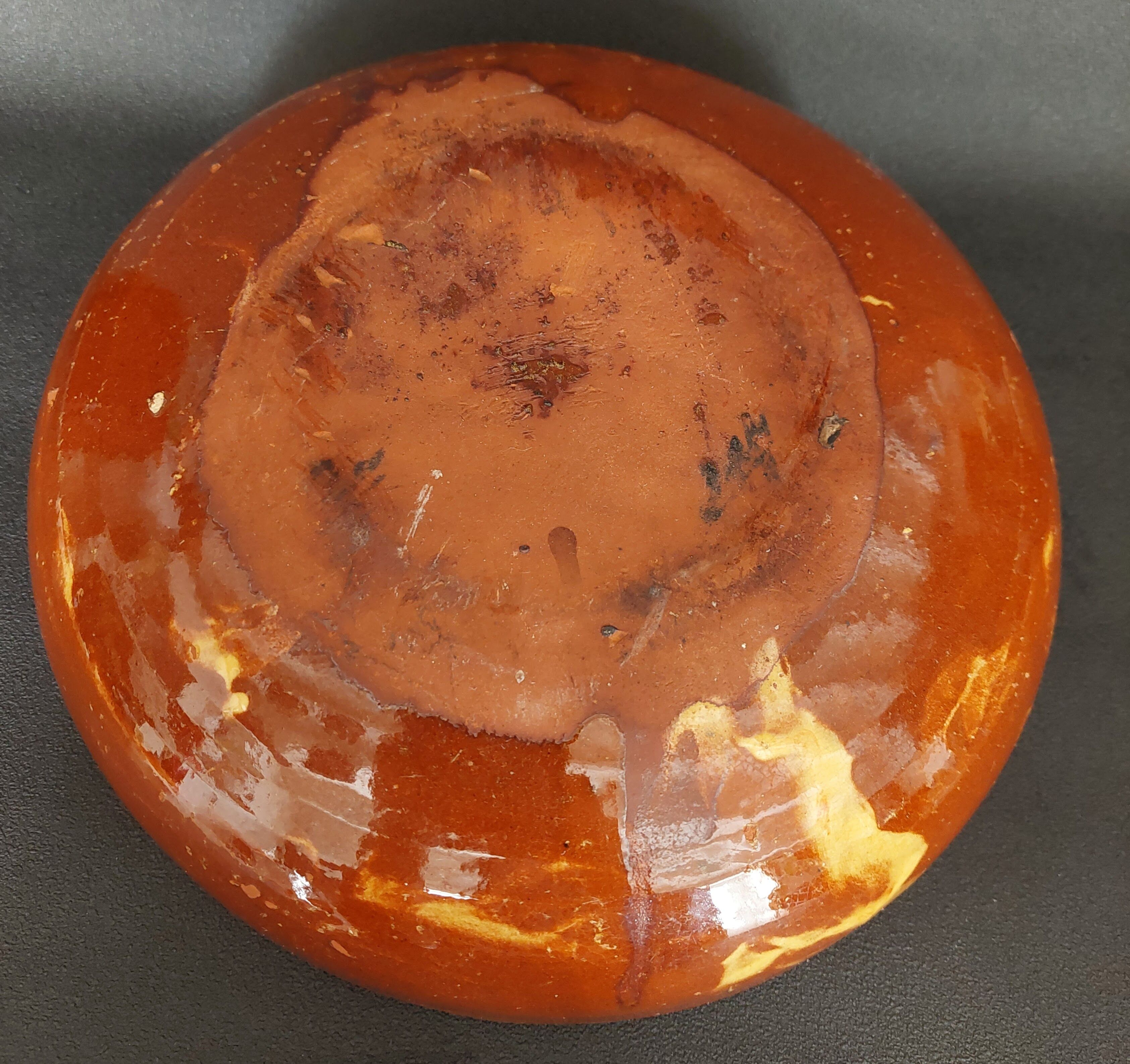 Glazed terracotta shallow dish from the 20th century.