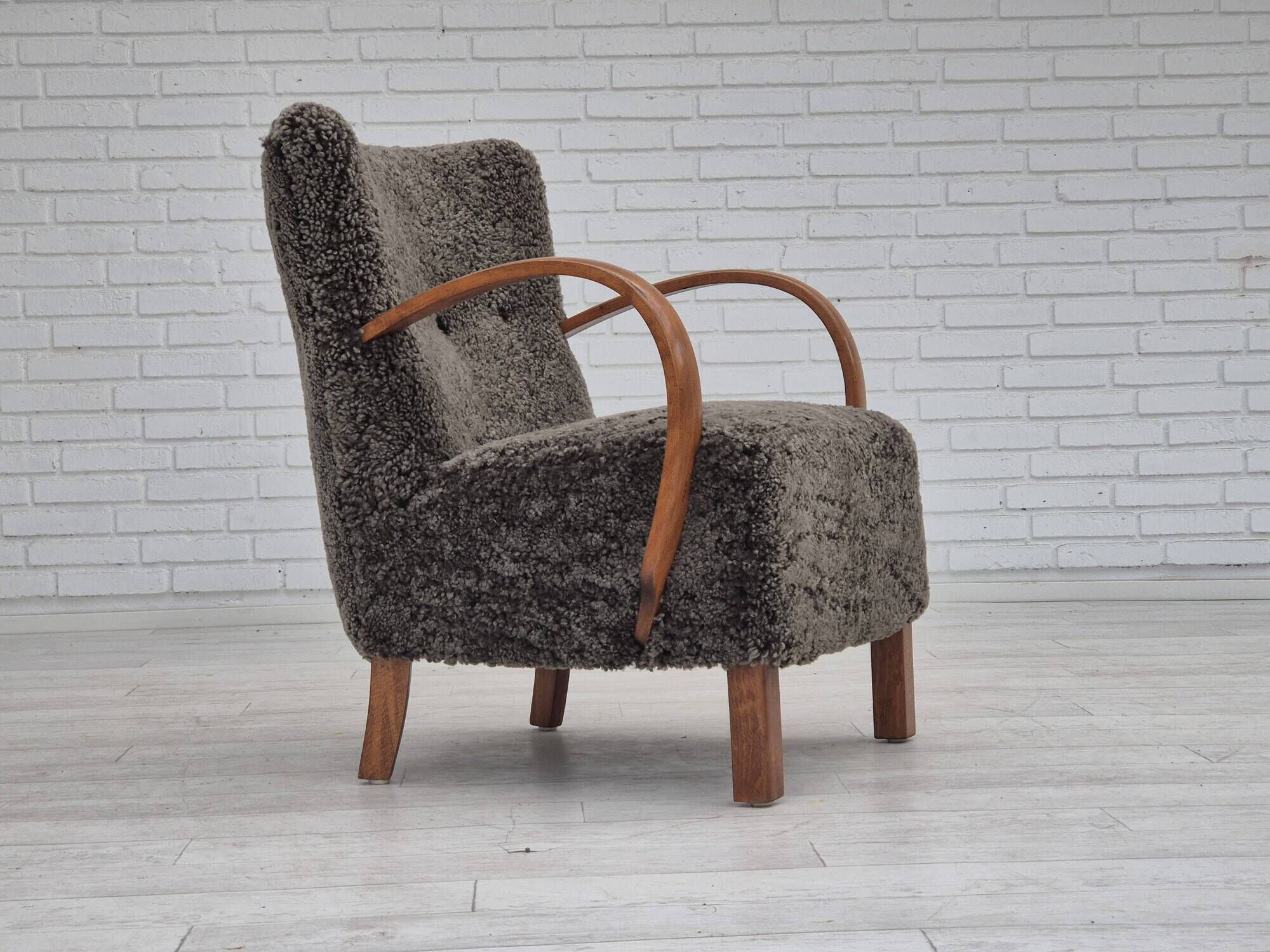 1960s, completely reupholstered Danish art deco armchair, genuine sheepskin "Wellington".