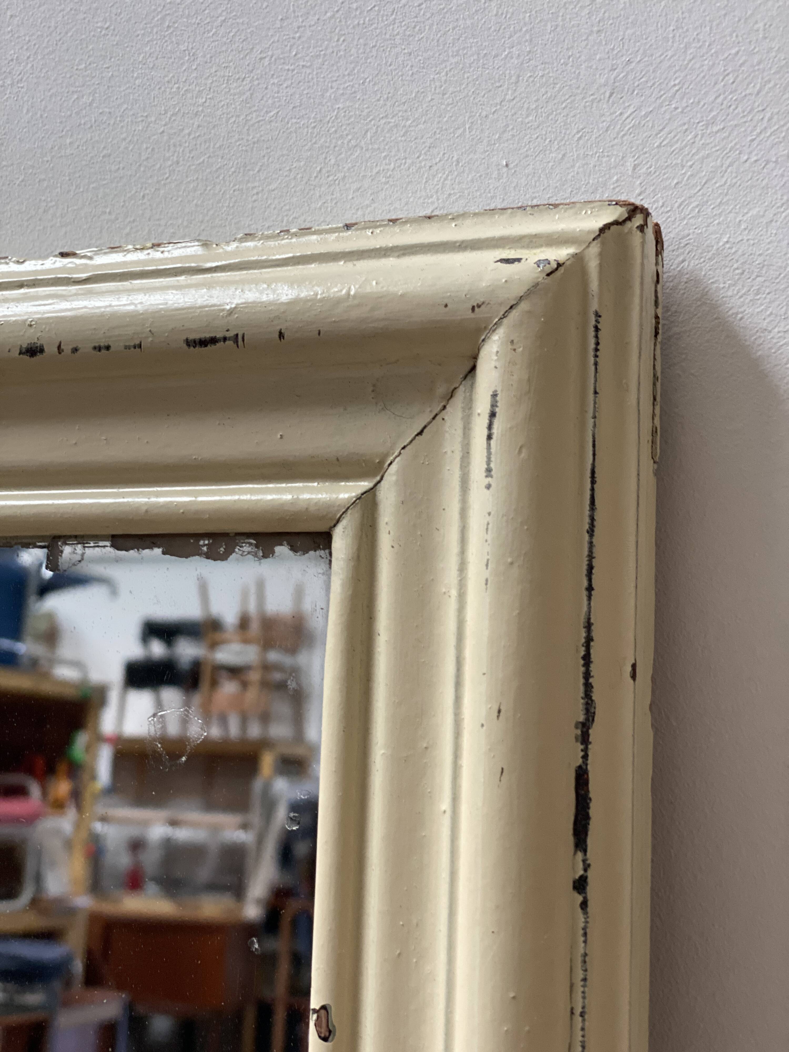 Antique mirror with beige patina
