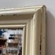 Antique mirror with beige patina