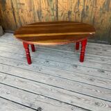 Oval coffee table in wood and red