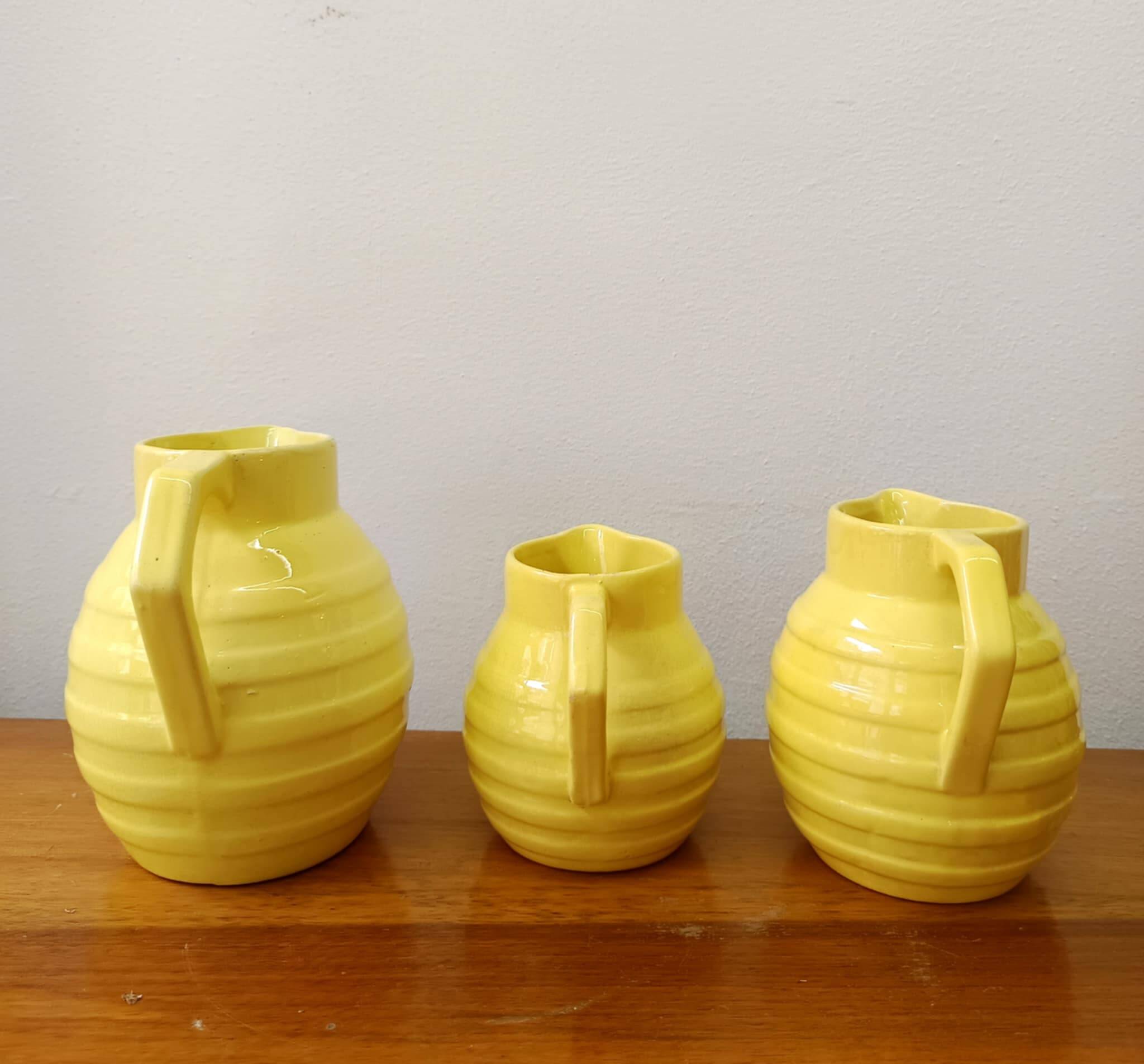 3 Orchies art deco pitchers in yellow ceramic
