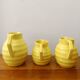 3 Orchies art deco pitchers in yellow ceramic