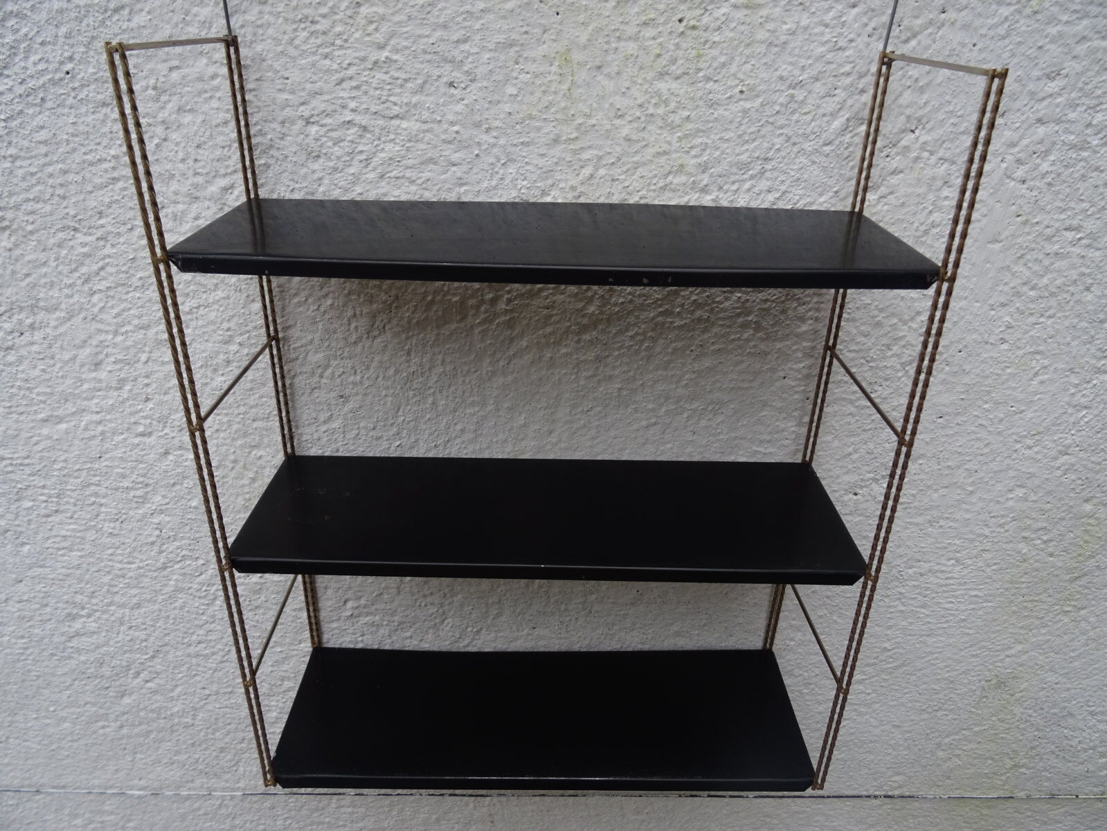 Metal thong wall shelf