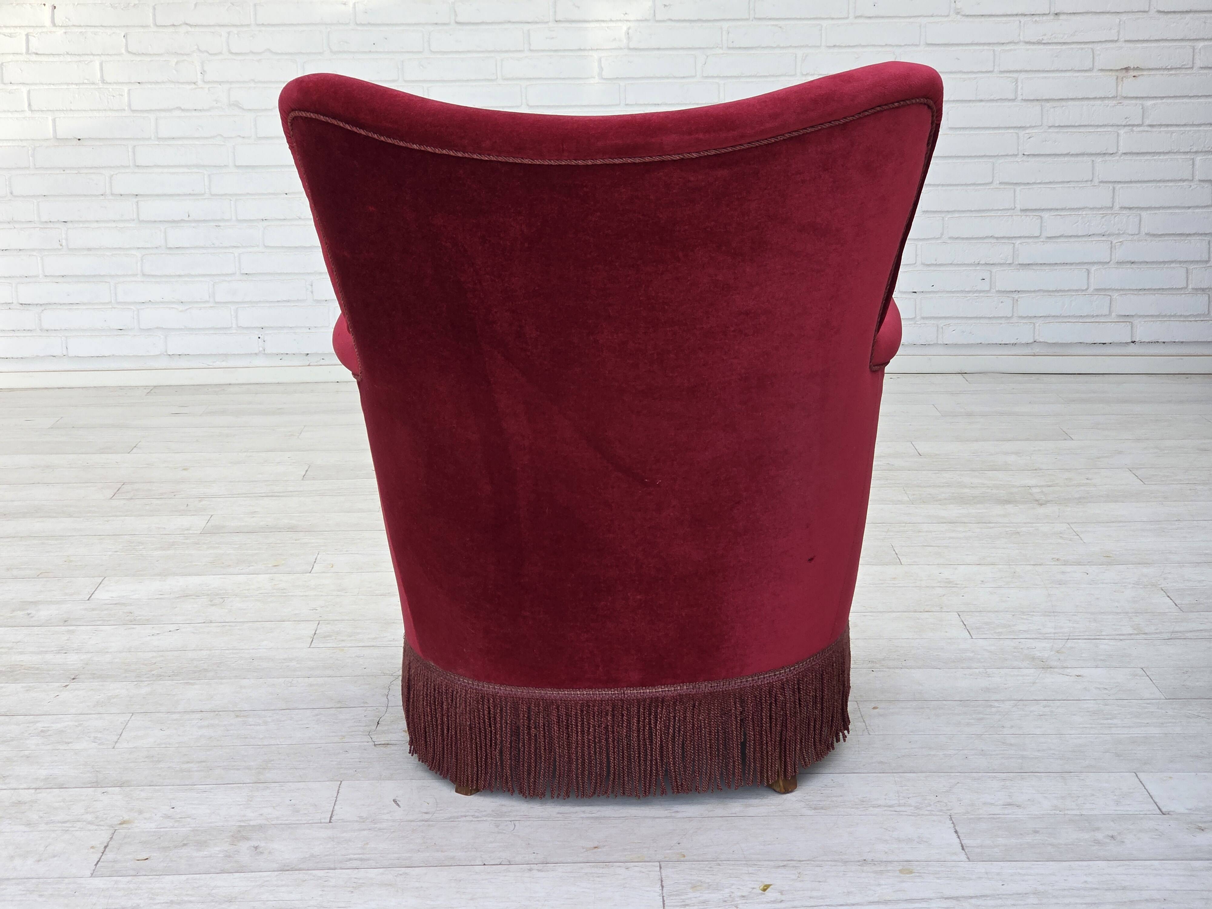 1970s, Danish armchair, cherry-red furniture velour, oak wood legs.