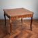 Game table in marquetry in the Louis XV style from the late 19th century.