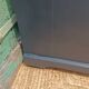 Vintage commode revamped in matte black & wood with warm tones.
