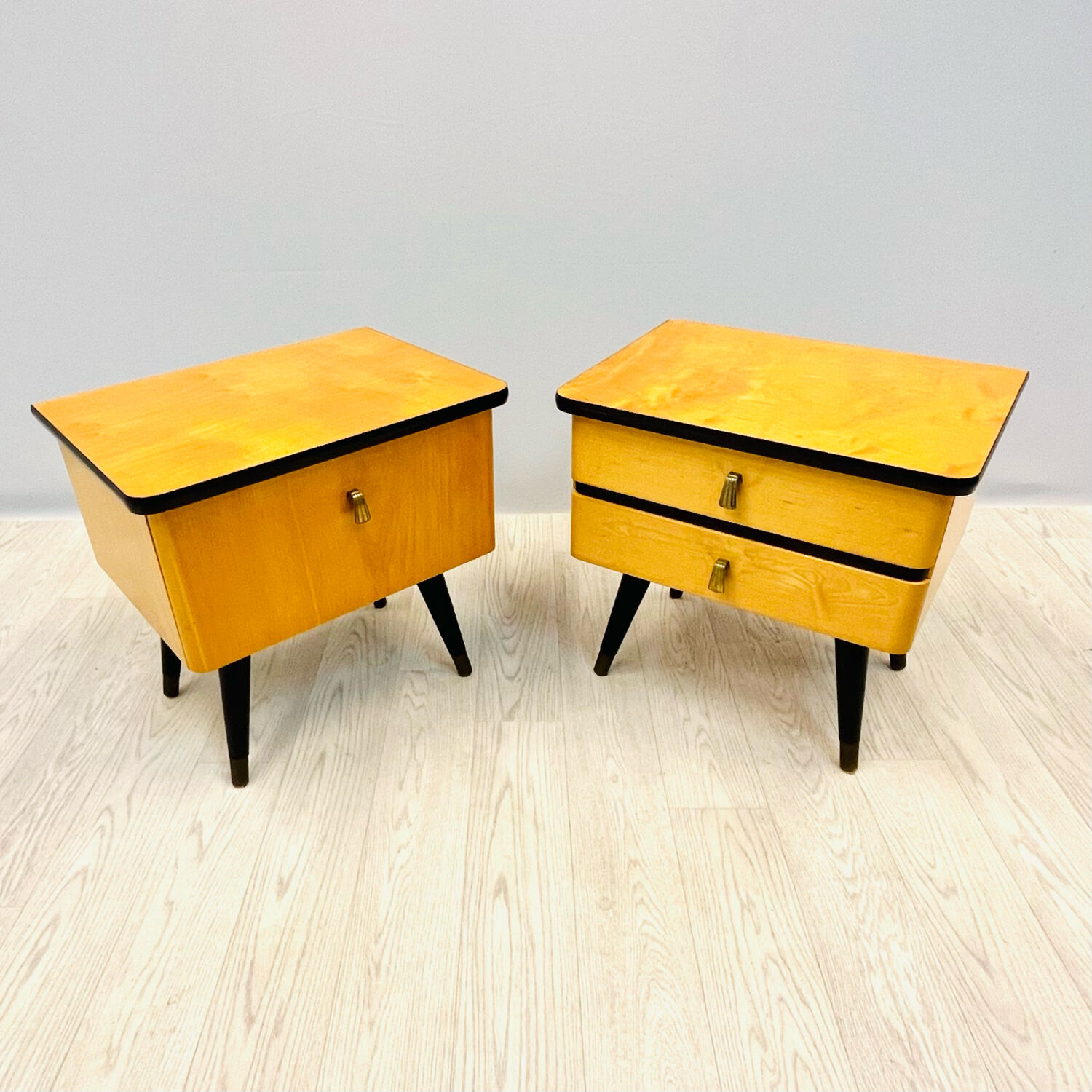 A pair of night cabinets