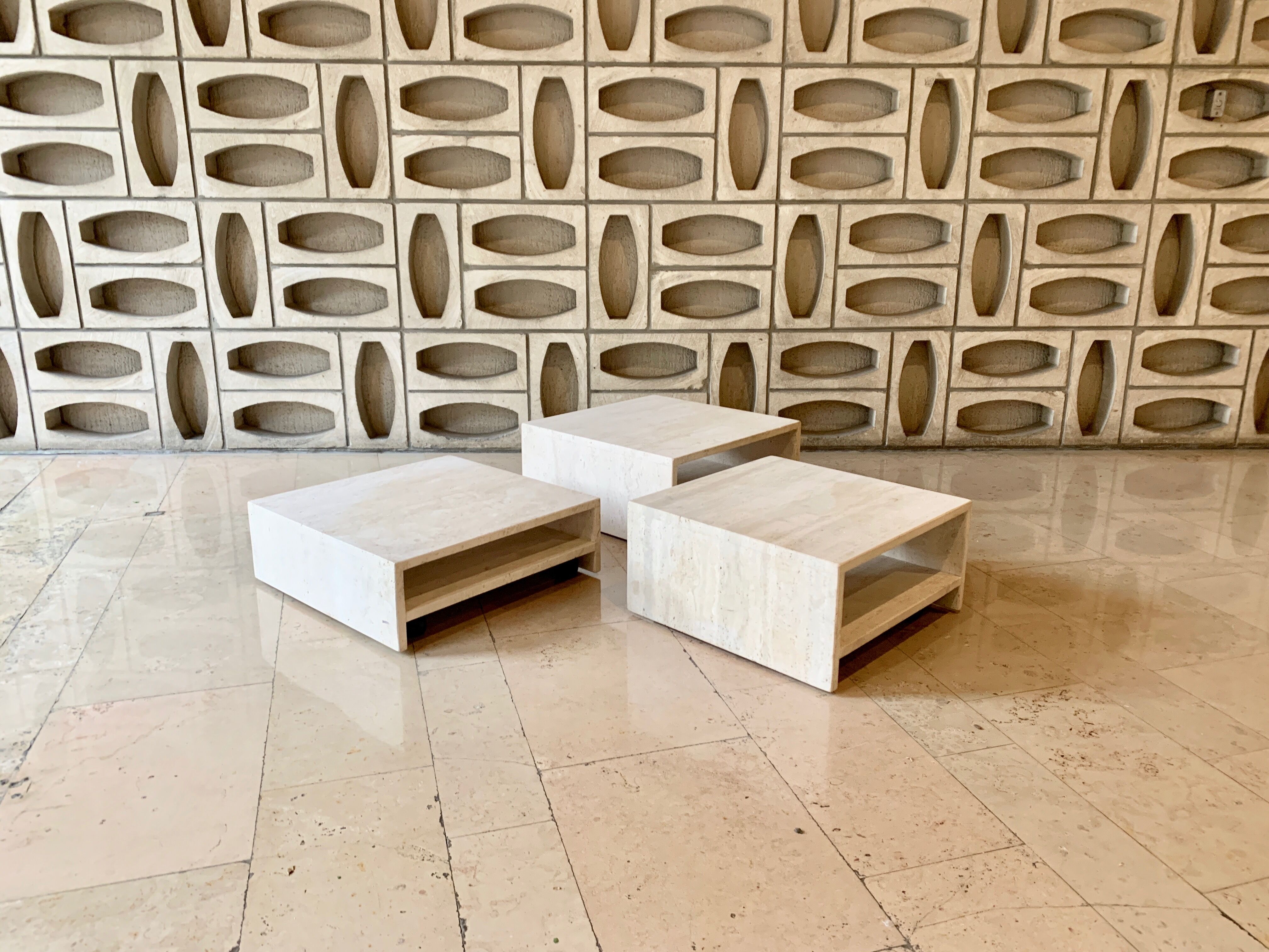 Modular square coffee tables in softened travertine